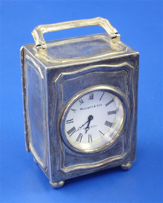 A 20th century sterling silver cased carriage timepiece, retailed by Elliott & Sons, London, 3in excl. handle.